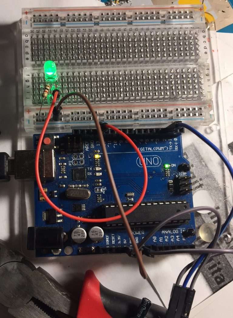 Connecting and uploading the code for the PIR motion sensor.